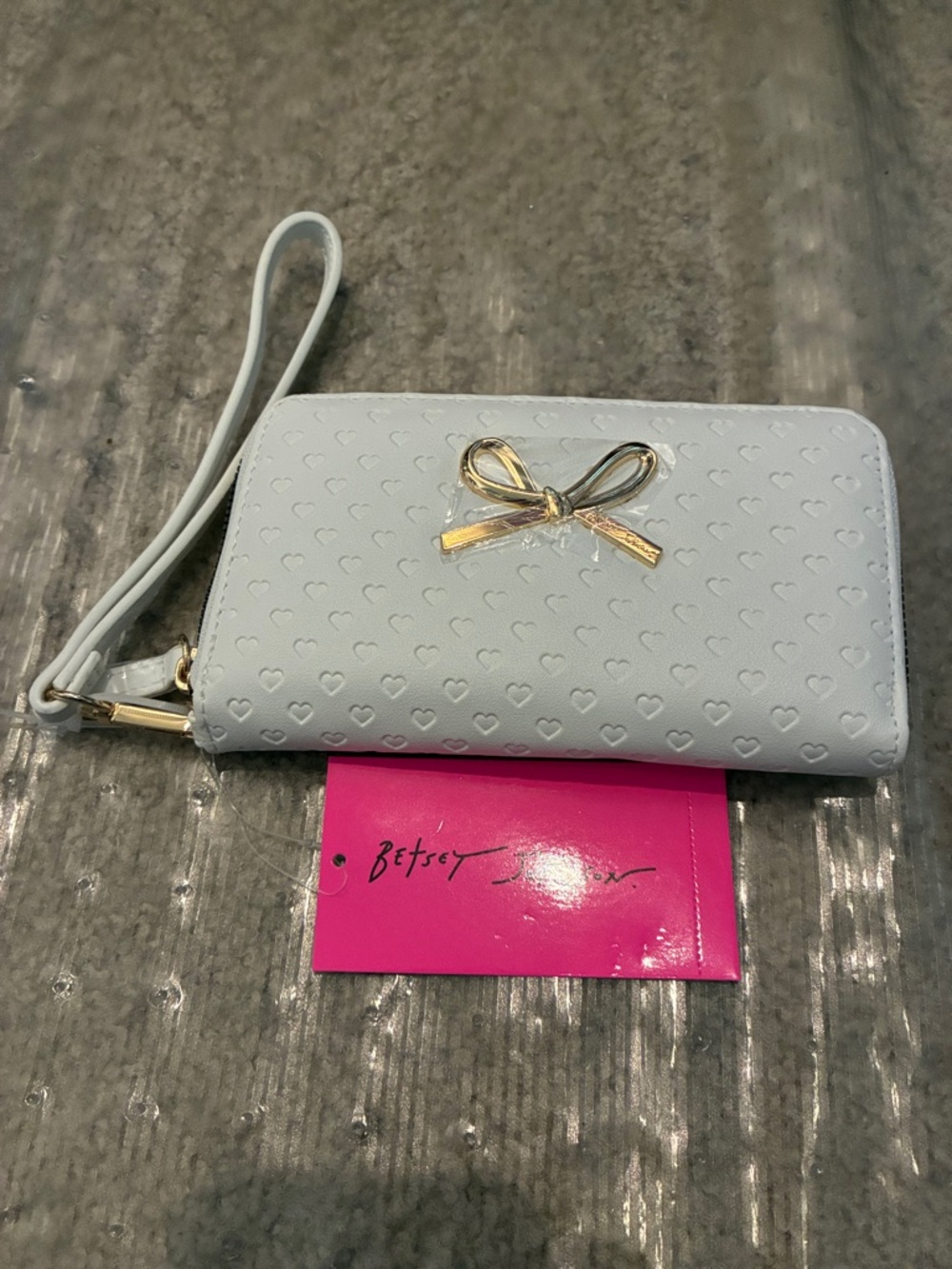 Betsey Johnson white Wristlet with Gold Bow Accent